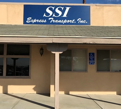 Mounted metal sign for SSI Express Transport in Rialto, CA