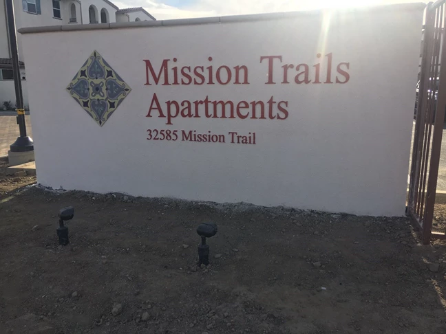 Monument sign for Mission Trails Apartments in Corona, CA 